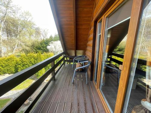 Balkons/terase, Holiday home with a garden, right by the lake in Mocki