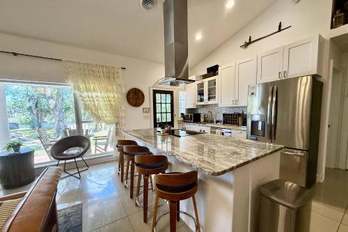 Hideout on the Hillsborough is a Gorgeous Renovated 3BR Pet Friendly Home on the Hillsborough River located in the North End of Seminole Heights in Tampa, USA