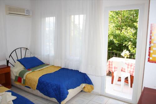 Happy Nur Hotel Located in Oludeniz, Happy Nur Hotel is a perfect starting point from which to explore Fethiye. The property offers guests a range of services and amenities designed to provide comfort and convenience