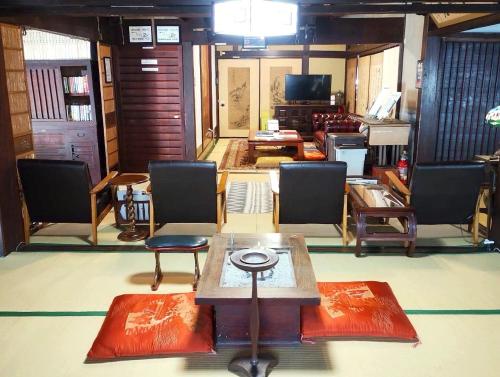 Shared lounge/TV area, 以久波別邸虎屋 in Ukiha