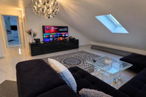 Közös társalgó / TV, Designer-Apartment mit Spa-Badewanne nähe Nürnberg (Designer-Apartment mit Spa-Badewanne nahe Nurnberg) in Fürth