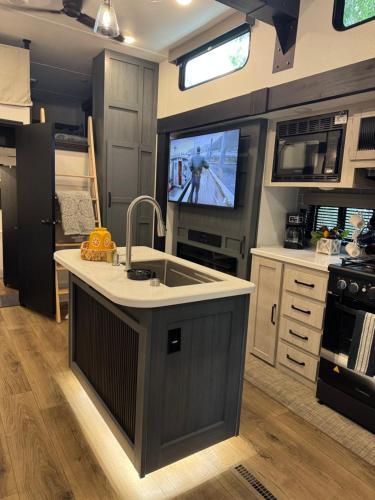 Extra large 4 bedroom with two full bath glamping rv with golf cart
