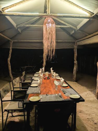 Restaurant, Camp Naledi - Exclusive Safari Tented Lodge with River View I Full Board I Natural Plunge Pools I Fr in Ngwala