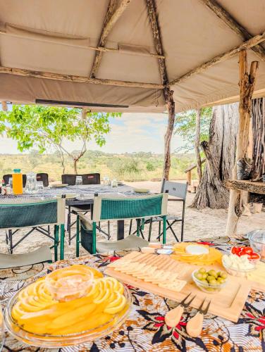 Food and beverages, Camp Naledi - Exclusive Safari Tented Lodge with River View I Full Board I Natural Plunge Pools I Fr in Ngwala