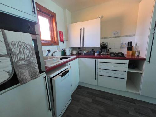 Woodlands Cottage cottage sleeps 5 in Inchbae Lodge