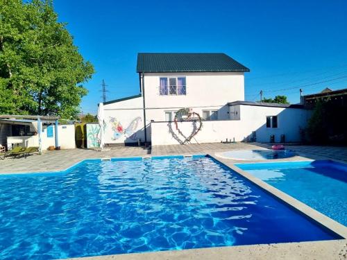Exterior view of Laguna House next to Pool at Bazaleti Lake