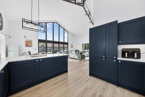 Luxury Norfolk Barn for 12 with Hot Tub , Games Room & EV Car Port in Weston Longville