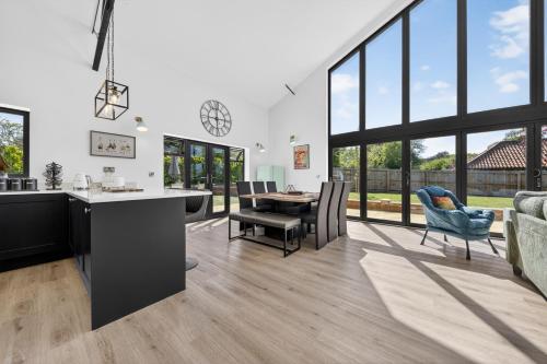 Luxury Norfolk Barn for 12 with Hot Tub , Games Room & EV Car Port in Weston Longville