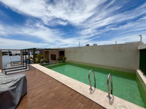 Cerca de la playa con alberca y asador en roof