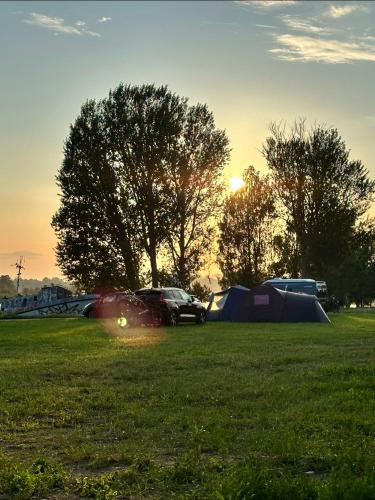 Natura Park Jurmala campsite with tent sites near a river in Jurmala