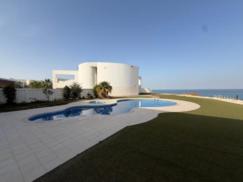 Elegant 5BR Villa with Private Pool & Private Beach Access Durrat Al Bahrain in Sakhir