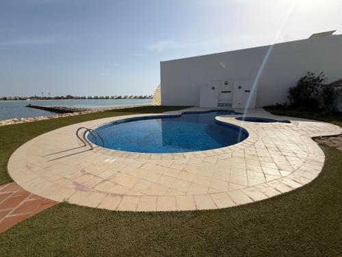 Elegant 5BR Villa with Private Pool & Private Beach Access Durrat Al Bahrain in Sakhir
