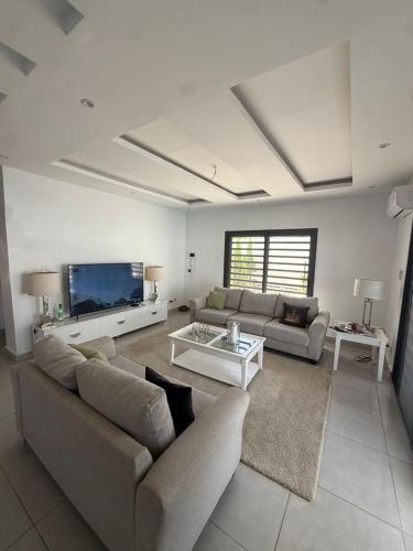 Delt lounge/TV-område, Résidence Keur Coumba (Residence Keur Coumba) in Ngaparou