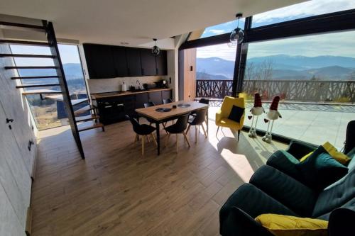 House with a garden and a view of the mountains in Stryszawa
