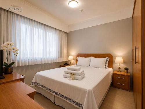 客室内ベッド, Lapidare Flat Hotel Comfor Alphaville até 4 pessoas (Lapidare Flat Hotel Comfor Alphaville ate 4 pessoas) in バルエリ