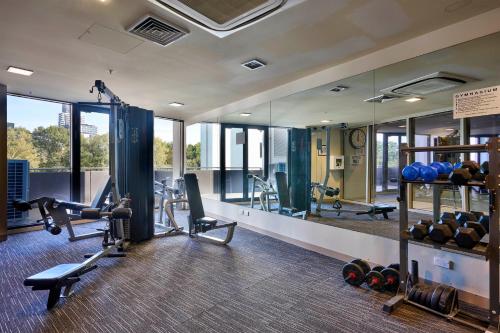 Fitness center, Elegant 2BR CBD Apartment with Balcony, Pool, Gym, Sauna & Fast WiFi near Queen Victoria Market in Other