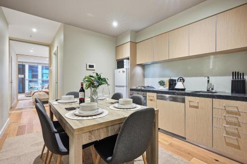 Kitchen, Elegant 2BR CBD Apartment with Balcony, Pool, Gym, Sauna & Fast WiFi near Queen Victoria Market in Other