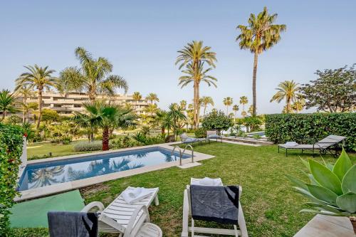 Luxury Beachfront Apt with Private Garden & Pool