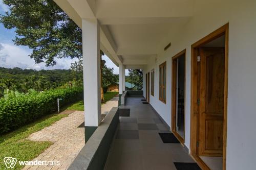 ทัศนียภาพภายนอกโรงแรม, วิสเพอริง วิลโลว์ - อะ วันเดอร์เทรล โชว์เคส (Whispering Willows - A Wandertrails Showcase) in มูทุมาลัย