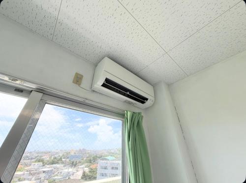 ハイ沖縄金武店トイレお風呂共用 プレオープン中駐車場有 ペット同伴可能長期滞在可能2025年10月より車貸し出しサービス有希望であればお申し付けください in Kin