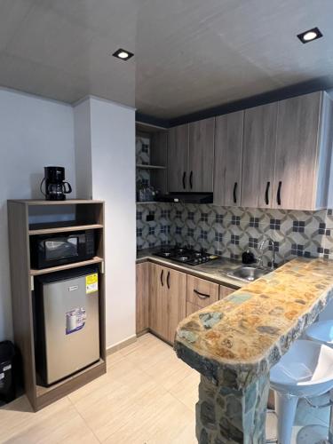 Kitchen, Pereira Airport Suites in San Joaquin