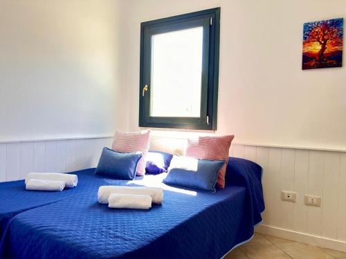 Casa Spaziosa con giardino e piscina nel residence in Santa Maria Coghinas