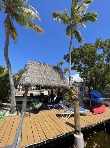 Waterfront Tiny House w Pool, Beach, and Boat Dock