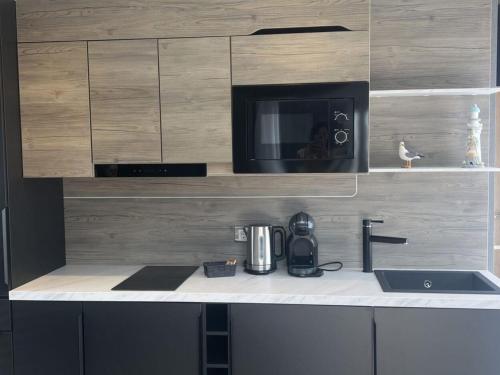Kitchen, Holiday Home Hotel Chalet by Interhome in Sint Maartensdijk
