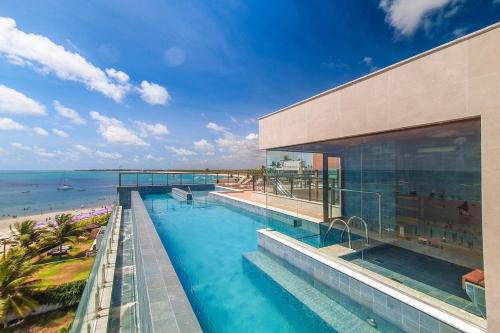 Apartamento Mirante de Porto 203 Pe na areia em Porto de galinhas – khách sạn tại Khac