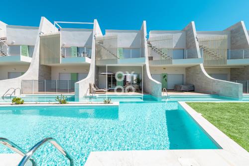 Marina Garden Swim-Up Suite, direct pool access, colourful boho chic resort retreat - by OYOOSTAYS