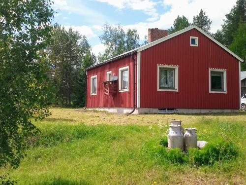 . Swedish Lapland, cottage near lake, dogsled, boat