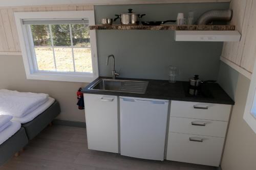 Viesnīcas āriene, Camping cottages in nature Shared toilet and shower in Hommelsto