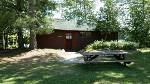 . Serene Lakefront Cabin with Picture-Window Fishing Beside Covered Boathouse in Orr, Minnesota