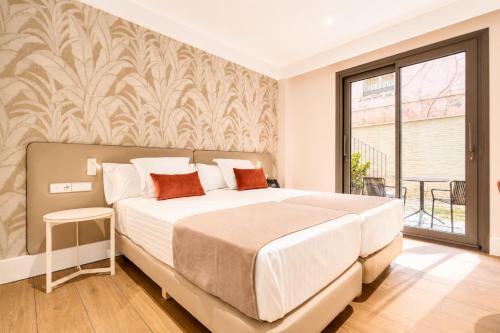 Chambre avec 2 lits, vue sur le jardin