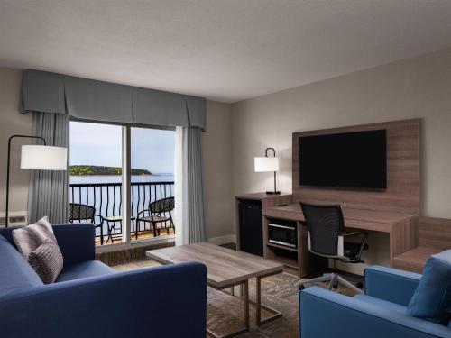 Anchor Inn & Suites, BW Signature Collection Room Type - King Suite - Mobility Accessible with Roll-In Shower and Living Room