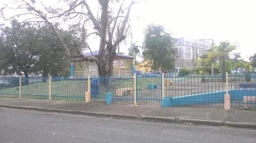 a fence that has a bunch of fences around it, Calle Hollanda 3 Bedroom Home in San Juan