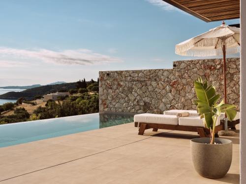 Theros Luxury Suites - Tap to explore photos