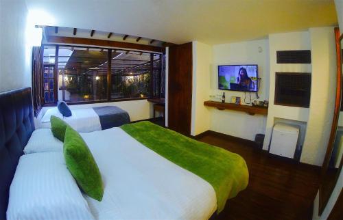 Hotel Casona Usaquen - Tap to explore photos