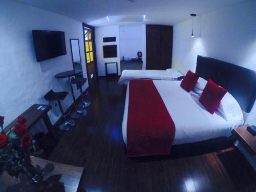 Hotel Casona Usaquen - Tap to explore photos