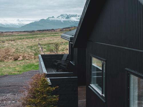 Waterfall Villa - Black Beach & Fjord Views in Karlsstaðir