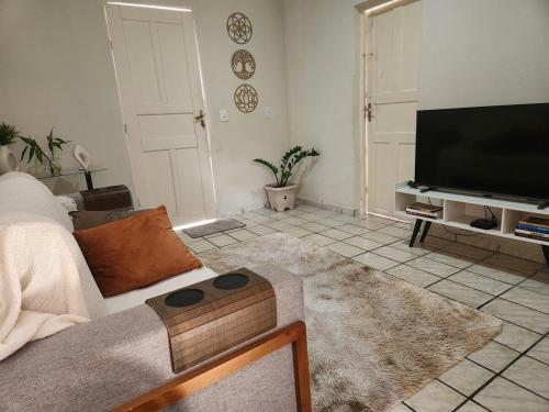 Koplietošanas atpūtas telpa ar TV, Casa simples e funcional in Aimorés