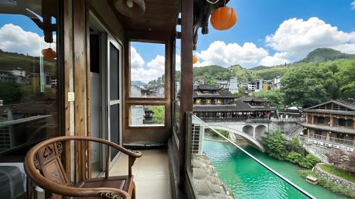 Huaqianshu Theme Inn 高铁免费接站或送站一次 in Xiangxi