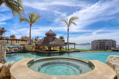 Stylish Coastal Retreat with Breathtaking Views, Resort Pool & Private Balcony