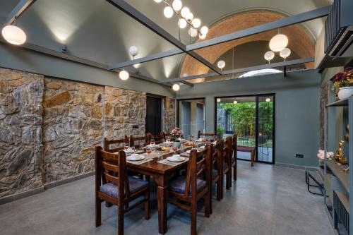 ELIVAAS Signature Stone Age Home Fernwood 6-BHK Stone-Clad Estate with Bamboo Cottages, Private Pool in Jaswantpura