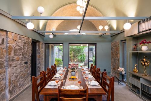 ELIVAAS Signature Stone Age Home Fernwood 6-BHK Stone-Clad Estate with Bamboo Cottages, Private Pool in Jaswantpura