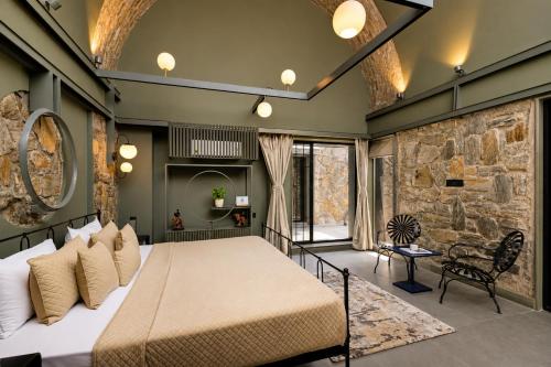 ELIVAAS Signature Stone Age Home Fernwood 6-BHK Stone-Clad Estate with Bamboo Cottages, Private Pool in Jaswantpura