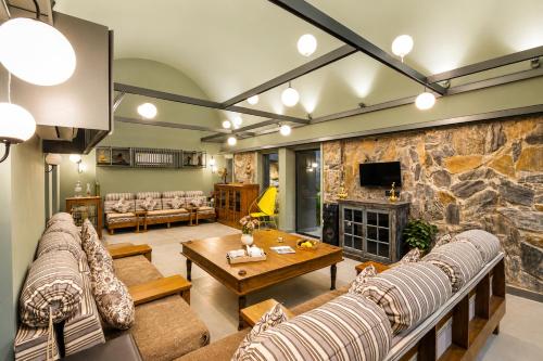 ELIVAAS Signature Stone Age Home Fernwood 6-BHK Stone-Clad Estate with Bamboo Cottages, Private Pool in Jaswantpura