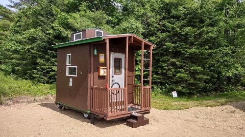. Whimsical Caboose Glamping Cabin with SpookyWoods Trail Near Penobscot River | Lincoln, Maine