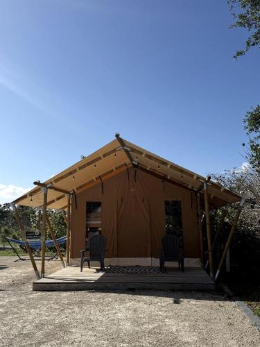 Charming Standard Safari Tent with Fire Pit Near Jonathan Dickinson State Park in Hobe Sound, Florida