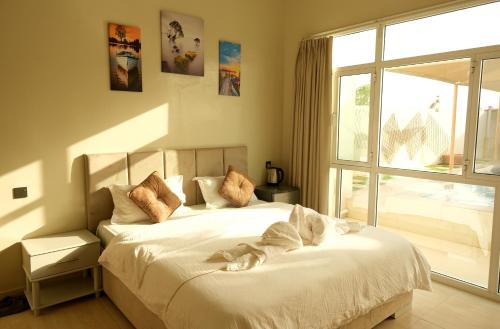 Bed, Sea Turtles Guest House in Ras Al Hadd